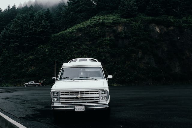 white chevrolet truck parked in front of mountain